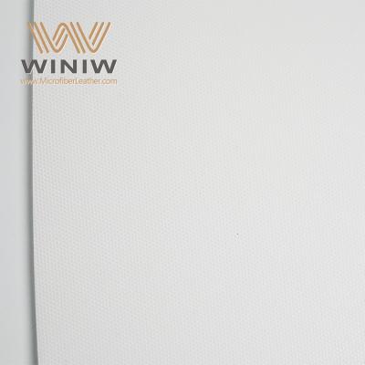 Couro sintético texturizado tipo nobuck resistente a rasgos para bolas de jogo de alta intensidade.